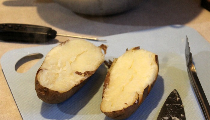 Sliced Open Baking Potatoes On Cutting Board