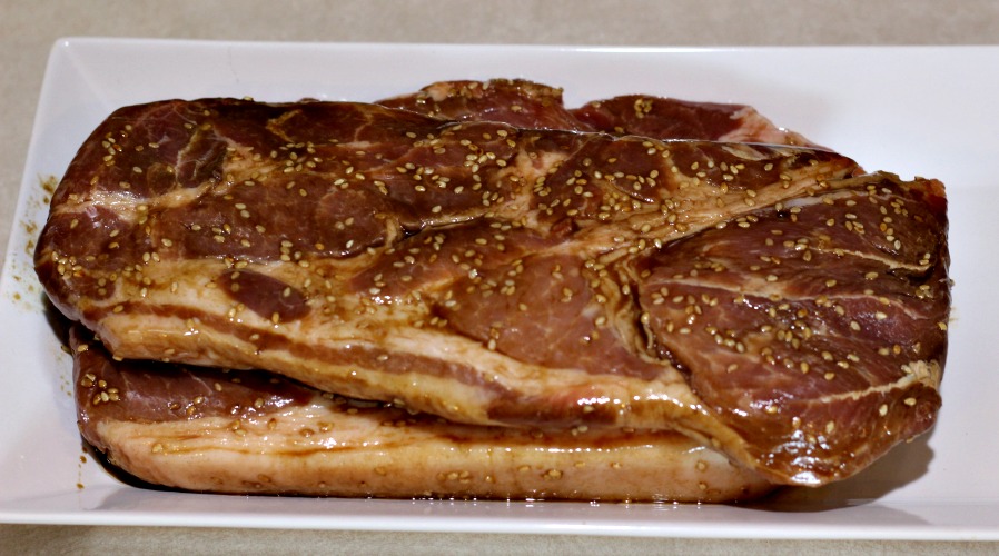 Seaosned Pork Steaks White Plate