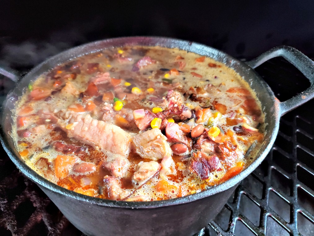 Lefover smoked brisket makes the perfect Spicy Smoked Brisket Chili Dutch Oven Recipe! Chop it up and throw in the pot with everything else and smoke more!