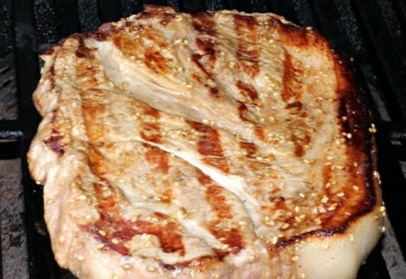This Easy Grilled Pork Steaks Recipe is perfect for a weeknight grilling recipe! Using sesame oil and sesame seeds as well gives an amazing flavor!