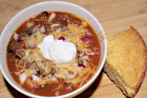 This Crockpot Prime Rib Chili Recipe is the perfect way to use up leftover prime rib from your holiday dinnner! Throw in the crockpot and allow it to cook!