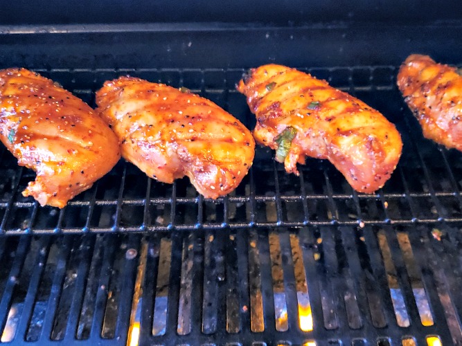Grilled Korean BBQ Chicken on the top rack of gas grill