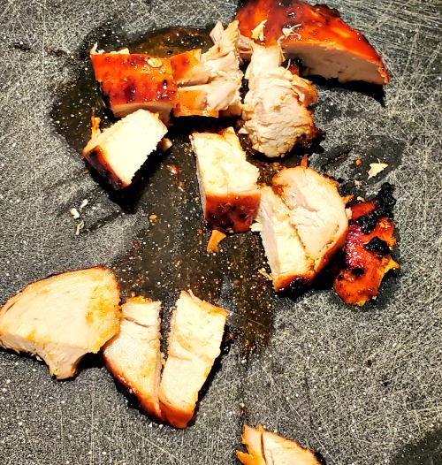 Grilled Korean BBQ Chicken Breast Cut on a cutting board