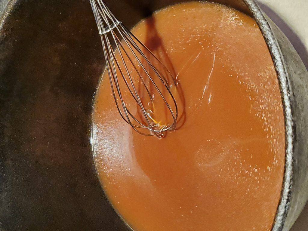 Whisk In Dutch Oven Mixing coffee and beef bullion