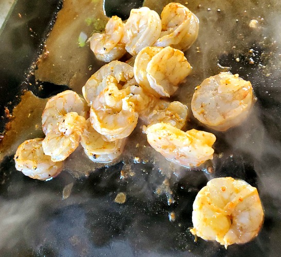 Shrimp for blackstone shrimp fajitas cooking on blackstone