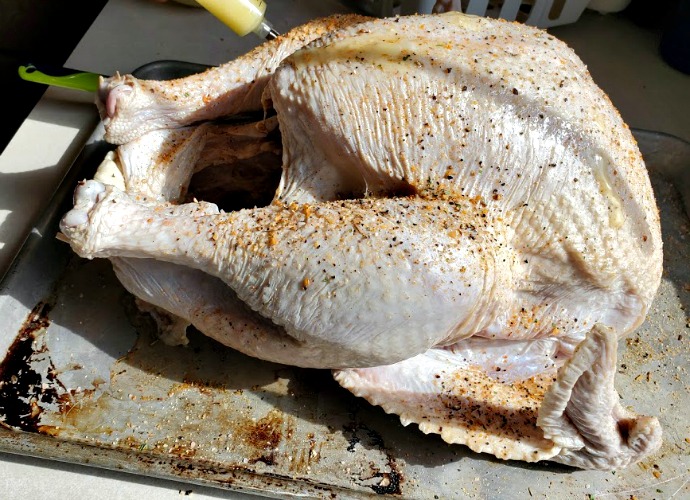 Turkey After Brine With Dry Rub Being Injected With Butter 