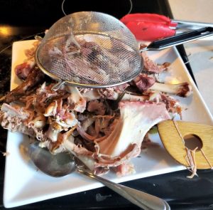 Turkey Carcass On plate with strainer with handle