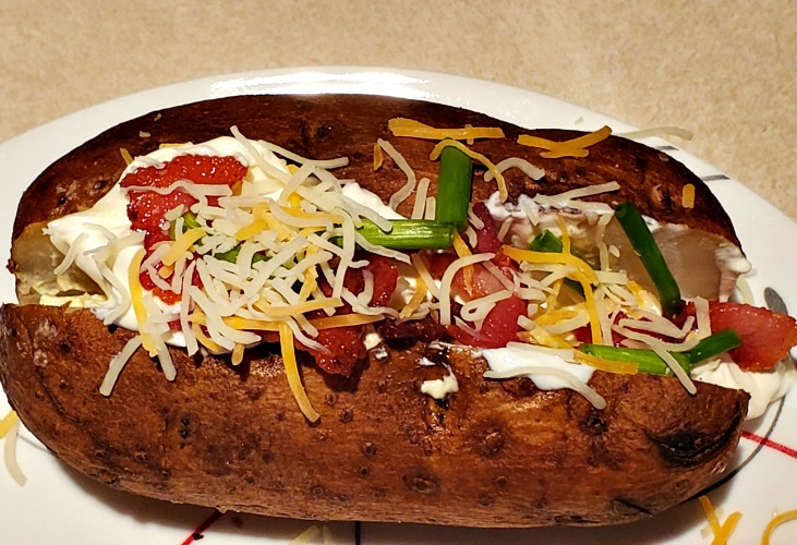  Smoke Baked Potatoes are the perfect way to make a classic with a new twist! Throw them on the smoker and avoid heating up the house for a tasty side dish. Load them up for the perfect loaded baked potato! 