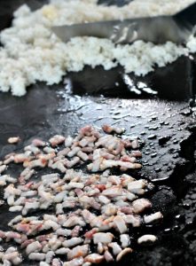 How To Make Hibachi Fried Rice on a Blackstone Griddle. This is easy to do with any meat and choice veggies and taste just as good as a Japanese Steakhouse.