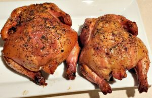 2 Mediterranean Smoked Cornish Game Hens on white plate