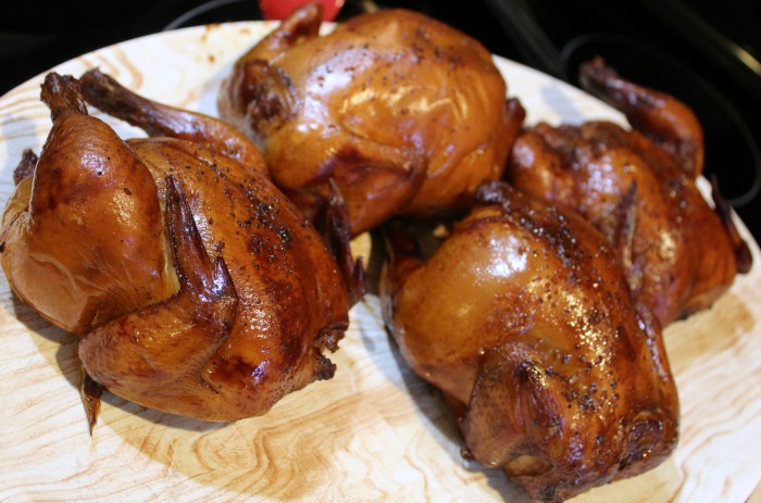 Smoked Cornish game hens on a platter 