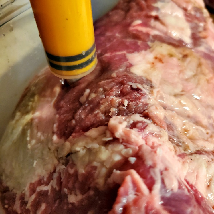 Brisket Being Injected With Marinade