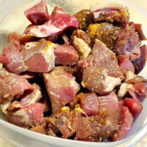 Seasoned Beef Stew Meat in Rubbermaid container for Smoked Beef Stew