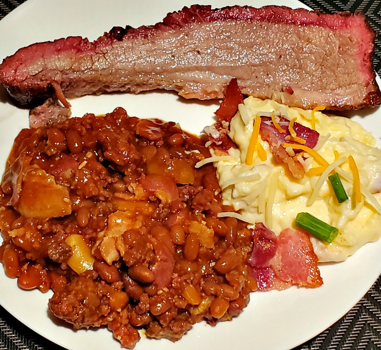 Smoked Baked Beans Served With Loaded Potatoes And Brisket