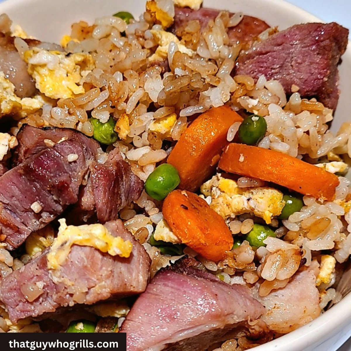 Blackstone Ham Fried Rice Served in a white bowl 