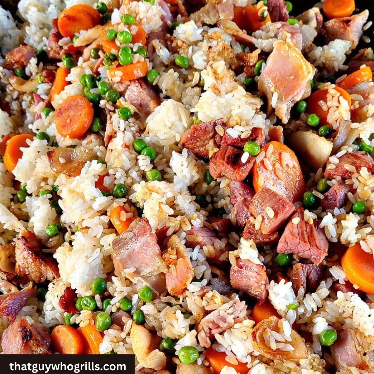 Leftover Smoked Ham Used to Make Fried Rice on the Blackstone with white rice, peas, carrots, bacon, and eggs.