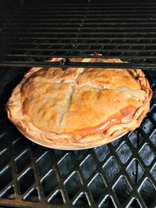 Smoked Chicken Pot Pie Recipe is the perfect comfort food to make on a pellet grill!! Smoke flavor is amazing on the crust and the chicken in the pot pie.