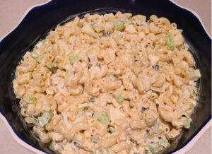 This Smoked Deviled Egg Macaroni Salad Recipe is the perfect side dish to make for any potluck or get-together! The smoke flavor on the eggs, onions, and celery adds to the whole dish! Perfect side dish for any bbq or backyard picnic get together.