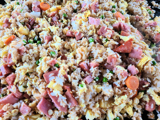 Spam Fried Rice Recipe On The Blackstone Griddle makes an amazing dinner and is easy to make as well!! Add in pineapple to make it a Hawaiian Fried Rice! This is a great version of hibachi fried rice as well.