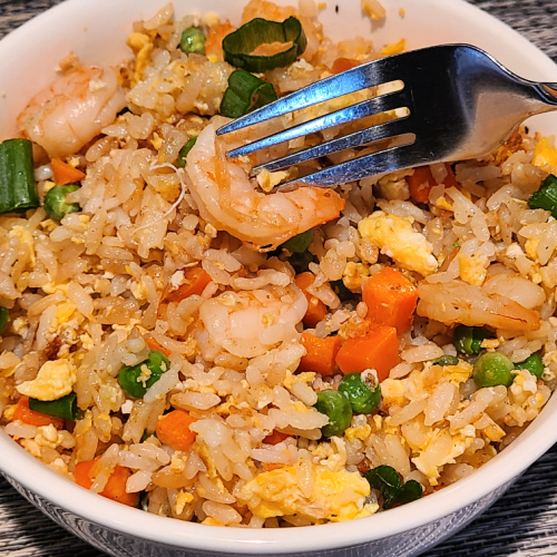Shrimp Fried Rice On Blackstone Griddle is perfect quick weeknight dinner to make up! Make on Blackstone to keep the kitchen clean & quick clean up!
