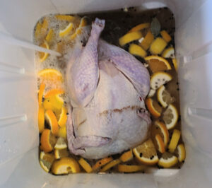 Bourbon Turkey Brine For Smoking Turkey! Perfect to make with Jim Beam Apple Bourbon, plus fruit in the brine and a butter injection! This bourbon brined turkey makes for perfect Thanksgiving dinner!
