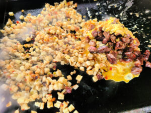 Leftover Prime Rib Breakfast Hash is perfect to use up leftover holiday smoked prime rib! The Blackstone or a griddle to make this meat and potato breakfast. Use Potato O Brien, eggs, and cheese to combine with the prime leftover for an amazing flavor combination! Making this on the Blackstone Griddle makes for easy cooking and clean up!