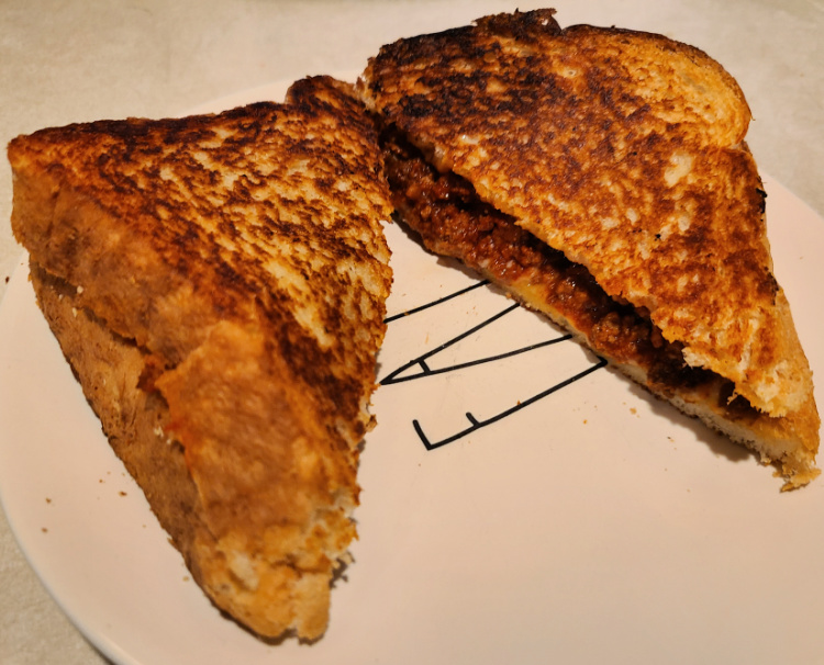 Sloppy Joe Grilled Cheese On A Blackstone Griddle is easy comfort food to make on the griddle! Serve up with tomato soup for a filling meal! You can use leftover crockpot sloppy joes or even just canned Manwich to make up this meal! Swap out with cheddar cheese, American cheese, mozzarella cheese, Havarti cheese, or any other cheese!