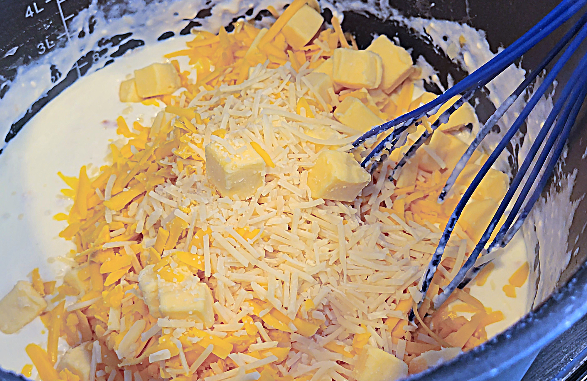Shredded Cheese in Pot with milk for Mac and cheese 