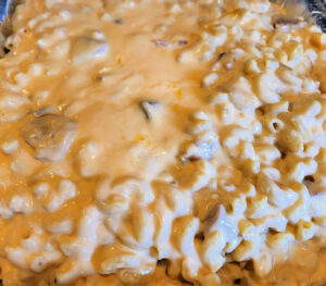 Smoked Ham Mac And Cheese in tin foil pan ready to smoke.