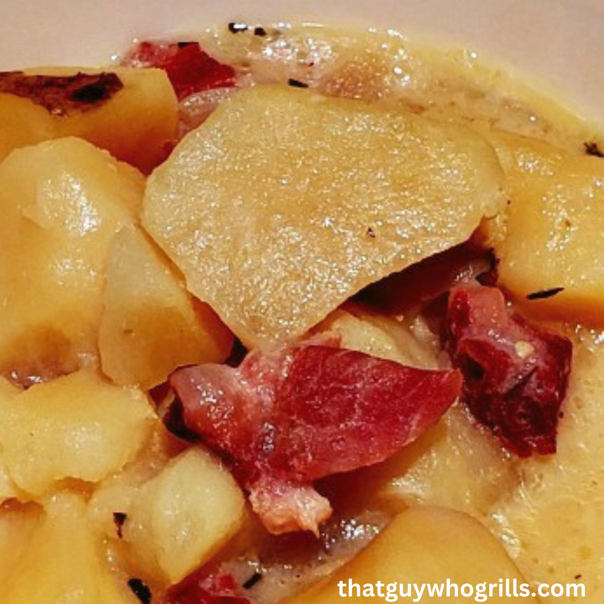 Slow Cooker Smoked Ham and potato soup sesrved in white bowl
