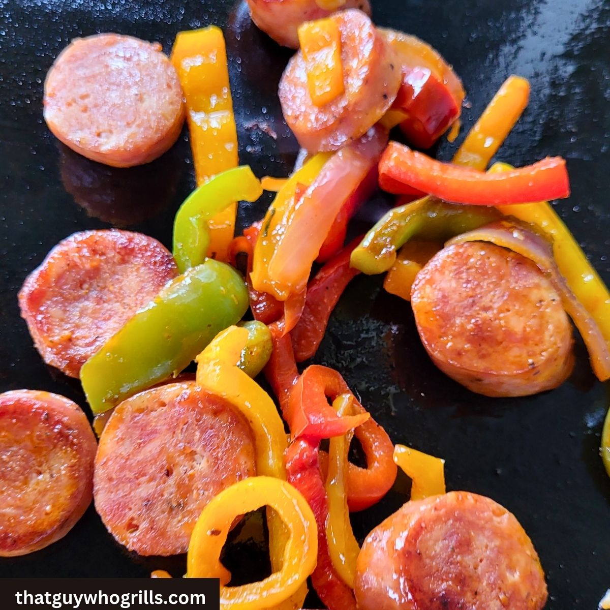 Blackstone Sausage and Peppers reheating on blackstone griddle 