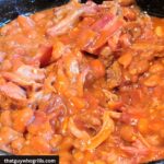 Smoked Pulled Pork Baked Beans in dutch oven