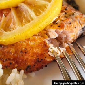 Grilled Salmon being peeled by a fork